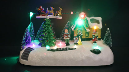 Christmas Village LED Musical Scene, 15 x 14 cm Illuminated Winter Display with Rotating Reindeer, Snow-Covered House, Christmas Trees, Holiday Figurines