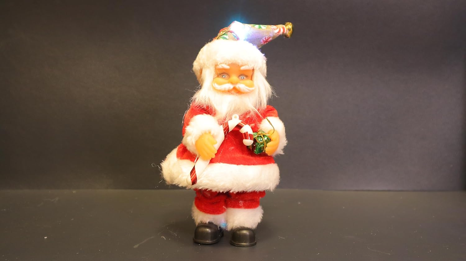 Musical Battery Operated Santa Claus Christmas Decoration, Red and White Plush Figure with Jingle Bell Music, 19 x 6 cm