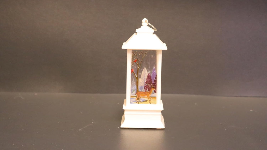 Christmas Decor Co. LED Christmas Lantern, White Metal Winter Scene with Reindeer, 14 x 6.5 cm, Battery Operated Holiday Decoration, Musical Snow Globe Style, Indoor Home Decor with Santa Design