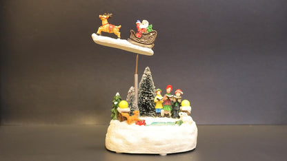 Animated Christmas Village Scene with Flying Santa Sleigh, Musical LED Winter Wonderland Decoration, Snow Base with Figurines, 13 x 11 x 20 cm