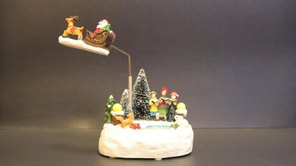 Animated Christmas Village Scene with Flying Santa Sleigh, Musical LED Winter Wonderland Decoration, Snow Base with Figurines, 13 x 11 x 20 cm